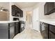 A well-equipped kitchen featuring black appliances and tiled floors at 434 Viewmont Dr, Henderson, NV 89015