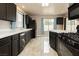 A kitchen with dark cabinets, light countertops, and modern appliances at 434 Viewmont Dr, Henderson, NV 89015