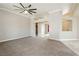 Spacious living room featuring neutral paint, carpet, and a modern ceiling fan at 434 Viewmont Dr, Henderson, NV 89015
