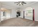 Open living room with neutral paint, carpet, and large windows for natural light at 434 Viewmont Dr, Henderson, NV 89015