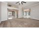 Spacious living room featuring neutral paint, carpet, and views into the dining area at 434 Viewmont Dr, Henderson, NV 89015