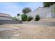 Large backyard with gravel landscaping, offering a blank canvas for creating a personalized outdoor space at 4439 Yellow Harbor St, Las Vegas, NV 89129