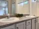 Bathroom featuring double sinks with modern faucets and decor at 4439 Yellow Harbor St, Las Vegas, NV 89129