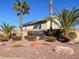 Monument at Lone Mountain community entrance, showcasing manicured landscaping and mature palm trees at 4439 Yellow Harbor St, Las Vegas, NV 89129