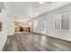 Open floor plan showcases the seamless flow from the living area to the kitchen and staircase at 4439 Yellow Harbor St, Las Vegas, NV 89129
