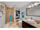 Beautiful bathroom with a stone shower, dark wood cabinets, and a white vessel sink at 4515 Dean Martin Dr # 200, Las Vegas, NV 89103