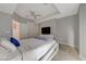 Contemporary bedroom with a tray ceiling, TV, and a comfy bed with a plush duvet at 4515 Dean Martin Dr # 200, Las Vegas, NV 89103