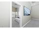 Modern bedroom with a neutral color palette, plush carpeting, and large windows for plenty of natural light at 4515 Dean Martin Dr # 200, Las Vegas, NV 89103