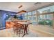 Contemporary dining room features an aquarium wall, city views, and modern lighting at 4515 Dean Martin Dr # 200, Las Vegas, NV 89103