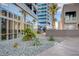 Modern building exterior with sleek architecture, lush landscaping, and inviting pathways for residents at 4515 Dean Martin Dr # 200, Las Vegas, NV 89103