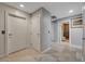 Hallway with neutral tones featuring access to storage, laundry, and a modern bathroom at 4515 Dean Martin Dr # 200, Las Vegas, NV 89103