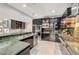 Stylish kitchen with stainless steel appliances, green marble countertops and glass display cabinets at 4515 Dean Martin Dr # 200, Las Vegas, NV 89103