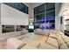Spacious living room area featuring multiple windows, sectional couch and city views at 4515 Dean Martin Dr # 200, Las Vegas, NV 89103