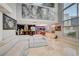 Spacious open-concept living room flowing into the kitchen with floor-to-ceiling windows and city views at 4515 Dean Martin Dr # 200, Las Vegas, NV 89103