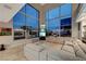 Spacious living room with expansive windows, sectional sofa, and views of the city skyline at 4515 Dean Martin Dr # 200, Las Vegas, NV 89103