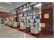 Comfortable seating area in the lobby with custom shelving and curated decor, providing a relaxing spot at 4515 Dean Martin Dr # 200, Las Vegas, NV 89103
