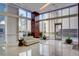 Bright lobby area with contemporary furniture, floor-to-ceiling windows, and elegant finishes at 4515 Dean Martin Dr # 200, Las Vegas, NV 89103
