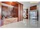 Grand lobby featuring a marble reception desk, chandelier, and elegant interior design at 4515 Dean Martin Dr # 200, Las Vegas, NV 89103