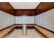 A well-lit mail room featuring multiple mailboxes, marble countertops, and wooden wall accents at 4515 Dean Martin Dr # 200, Las Vegas, NV 89103