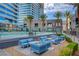 Inviting community pool with modern lounge seating and lush landscaping, perfect for relaxation and socializing at 4515 Dean Martin Dr # 200, Las Vegas, NV 89103