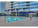 Community pool area featuring contemporary glass railings at 4515 Dean Martin Dr # 200, Las Vegas, NV 89103