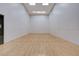 Racquetball court with a wood floor and white walls at 4515 Dean Martin Dr # 200, Las Vegas, NV 89103