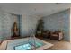 Stylish spa room featuring a built-in hot tub, mosaic tiling, and accent lighting at 4515 Dean Martin Dr # 200, Las Vegas, NV 89103
