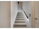 Carpeted stairs with a black handrail and modern design create an inviting path at 4515 Dean Martin Dr # 200, Las Vegas, NV 89103