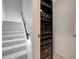 Carpeted stairs with a modern black handrail, next to an electrical control panel at 4515 Dean Martin Dr # 200, Las Vegas, NV 89103
