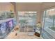 Beautiful views through expansive windows, showcasing city buildings and palm trees in a modern space at 4515 Dean Martin Dr # 200, Las Vegas, NV 89103