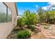 Backyard with desert landscaping and rock features at 4517 Rodman Dr, Las Vegas, NV 89130