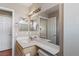 Bathroom features a single sink vanity, mirror, tiled shower, and toilet at 4517 Rodman Dr, Las Vegas, NV 89130