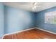 Bedroom painted blue, hardwood floors and one window at 4517 Rodman Dr, Las Vegas, NV 89130