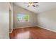 Bright bedroom features hardwood floors, a window, and a ceiling fan at 4517 Rodman Dr, Las Vegas, NV 89130