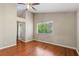 Bedroom boasts hardwood floors, a large window, and a ceiling fan at 4517 Rodman Dr, Las Vegas, NV 89130
