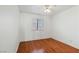 Bedroom featuring hardwood floors, window and ceiling fan at 4517 Rodman Dr, Las Vegas, NV 89130