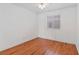 Bright bedroom with hardwood floors, a ceiling fan, and a window at 4517 Rodman Dr, Las Vegas, NV 89130
