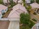 Beautiful home featuring a two-car garage, lush landscaping, and a well-manicured lawn at 4517 Rodman Dr, Las Vegas, NV 89130