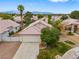 Charming home with a well-maintained lawn, mature tree, and a two-car garage in a desirable neighborhood at 4517 Rodman Dr, Las Vegas, NV 89130