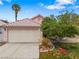 Charming single-story home showcasing a two-car garage, desert landscaping, and a welcoming entrance at 4517 Rodman Dr, Las Vegas, NV 89130