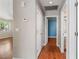 Hallway with hardwood floors connects bedroom, closet, and bathroom at 4517 Rodman Dr, Las Vegas, NV 89130