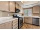 Bright kitchen features stainless steel appliances and ample counter space at 4517 Rodman Dr, Las Vegas, NV 89130