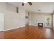 Bright living room with hardwood floors and fireplace, ceiling fan at 4517 Rodman Dr, Las Vegas, NV 89130