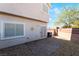 A cozy backyard with sliding glass door access and low maintenance desert landscaping at 4608 Snake Eyes St # 102, Las Vegas, NV 89122
