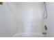 Clean white tiled bath and shower with shower head and faucet, perfect for relaxation at 4608 Snake Eyes St # 102, Las Vegas, NV 89122