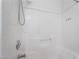 Clean white tiled bath and shower with shower head and faucet, ideal for a refreshing experience at 4608 Snake Eyes St # 102, Las Vegas, NV 89122