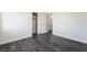 Neutral bedroom features gray wood-look floors, closet and open view at 4608 Snake Eyes St # 102, Las Vegas, NV 89122