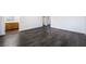 An empty bedroom showcasing wood-look flooring and natural light, leading into an en-suite bathroom at 4608 Snake Eyes St # 102, Las Vegas, NV 89122