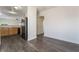 Open floor plan showcasing a dining area with sleek hardwood floors leading to a modern kitchen at 4608 Snake Eyes St # 102, Las Vegas, NV 89122
