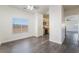 Bright dining area with hardwood floors, window, and open view to the kitchen, ideal for Gathering meals at 4608 Snake Eyes St # 102, Las Vegas, NV 89122